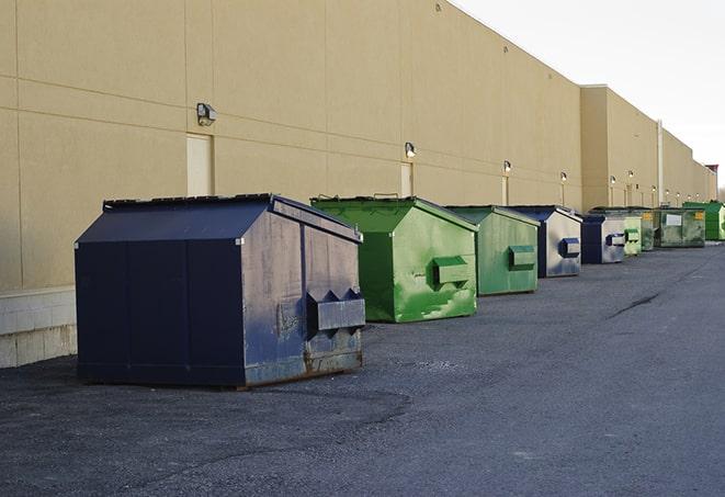 a large dumpster serves as a temporary waste container on a job site in Grain Valley